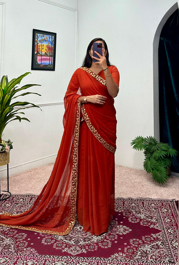 Good Looking Embroidery Work Orange Color Saree Gown