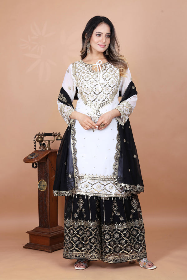 Fabulous Heavy Work White Color Suit With Black Sharara