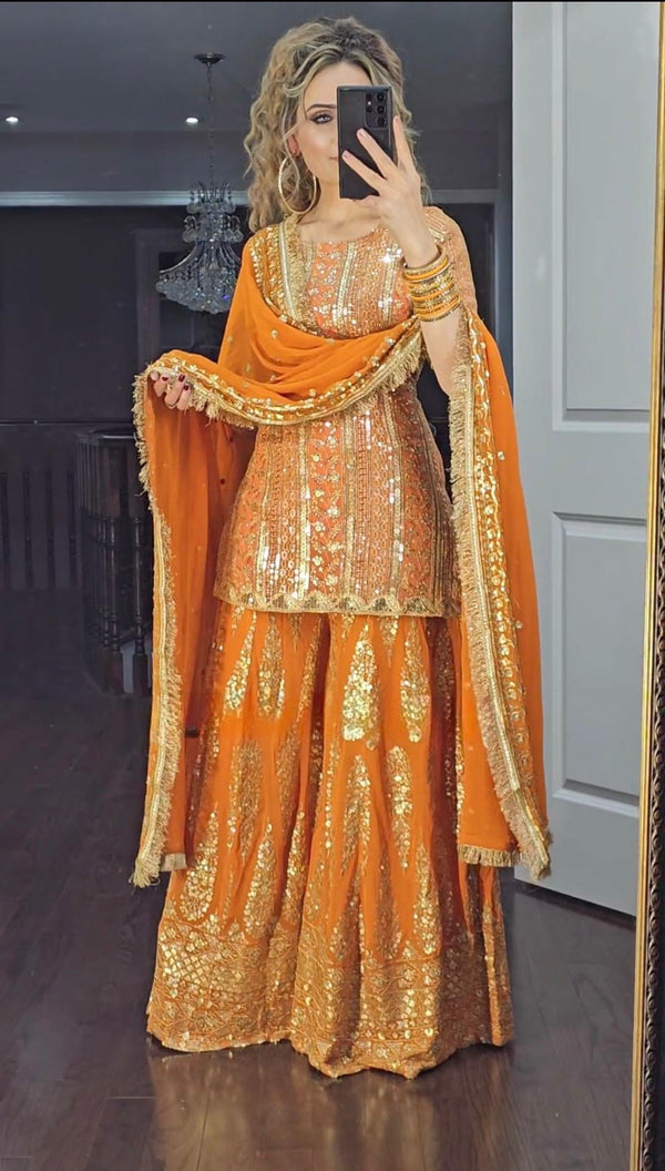 Eyes Catching Georgette Embroidery Work Orange Color Sharara Suit