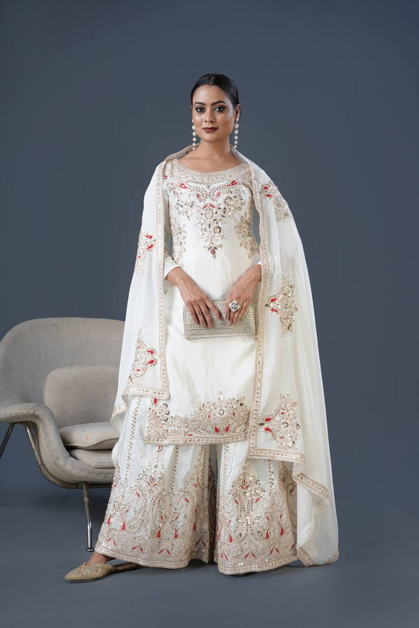 Mesmerizing  Embroidery And Sequence Work White Color Sharara Suit