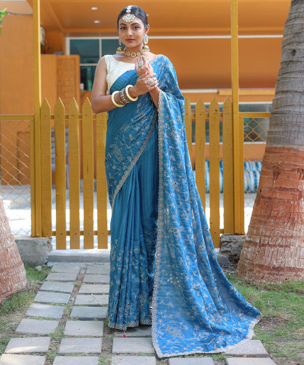 Captivating Silk Floral Design Teal Blue Color Saree
