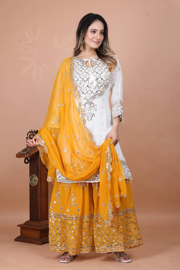 Fabulous Heavy Work White Color Suit With Mustard Sharara